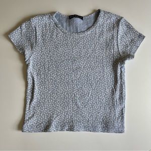 Brandy Melville light blue ribbed t-shirt with white flowers.